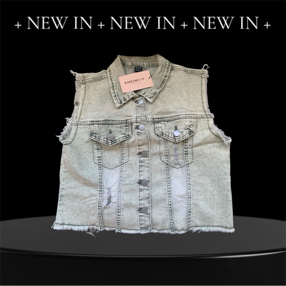 Woman’s distressed denim cut-off vest